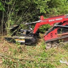 yard-clean-up-using-a-bush-hog-with-compact-track-loader-in-kannapolis-concord-harrisburg-Cabarrus-county-NC 0